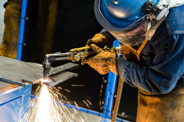 Man cutting iron