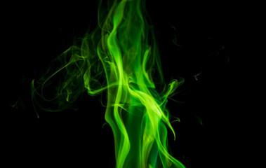 Green smoke on black background