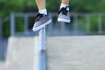 Wall Mural - legs walking on steel pipe with balance