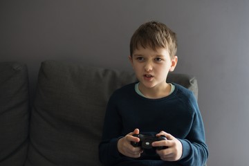 Angry child playing video games