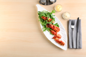 Sticker - Plate with bacon wrapped chicken nuggets on table