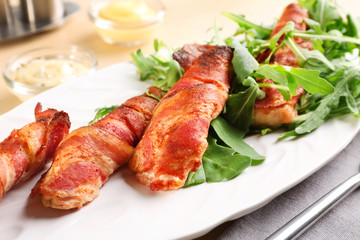 Sticker - Plate with bacon wrapped chicken nuggets on table, closeup