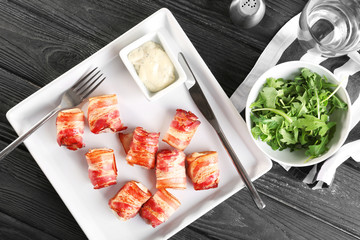 Sticker - Plate with bacon wrapped chicken nuggets on table