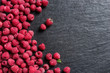 Sweet raspberry on black slate. Copy space. Top view. High resolution product.