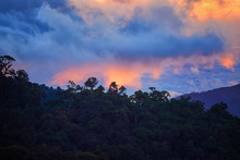 Evening View Of The Costa Rican Mountains, Cerro De La Muerte With A Volcano In The Clouds, Illuminated By The Setting Sun. Mountain Landascape. Los Quetzales National Park Nature Reserve. Costa Rica.