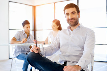 Poster - Young man in casual in office