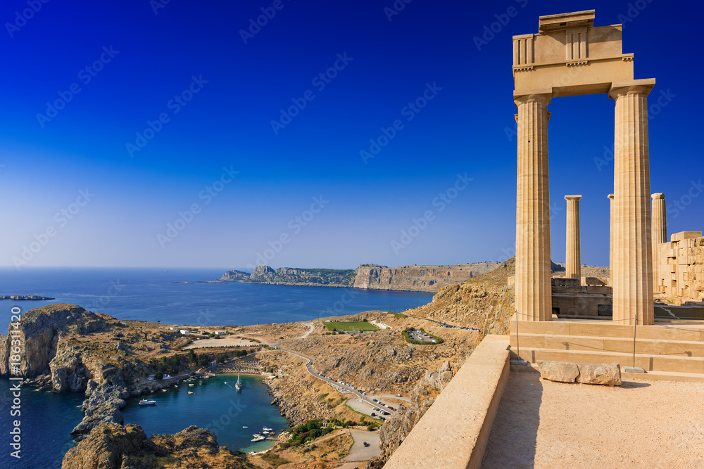 View of St. Paul´s bay and ancient temple of goddess Athena on acropolis of Lindos (Rhodes, Greece) - obrazy, fototapety, plakaty 