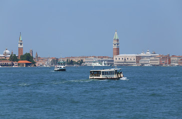 Wall Mural - cityscape View of the island of VENICE in Italy with the ancient palaces and bell towers from the ferry boat called Vaporetto in italian language