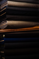 Suit Fabrics with Dark Color on a Fabric Shop Shelf