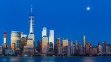 Fototapeta Nowy Jork - Lower Manhattan Skyline and moon rising at blue hour, NYC, USA