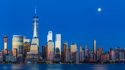 Wall Mural - Lower Manhattan Skyline and moon rising at blue hour, NYC, USA