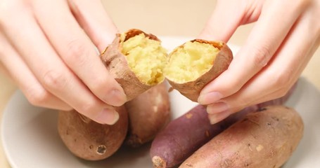 Poster - Woman holding cooked sweet potatoes