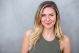 Confident composed distinguished relaxed calm natural expression portrait of a blonde woman