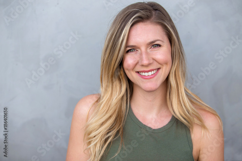 Cute natural blonde woman smiling with perfect white teeth and glowing skin Tableau sur Toile