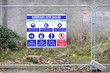 Building site rules health and safety sign on fence