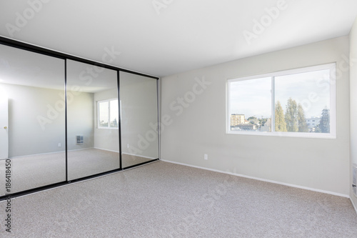Bedroom Empty With Mirror Closet And New Carpet For Virtual