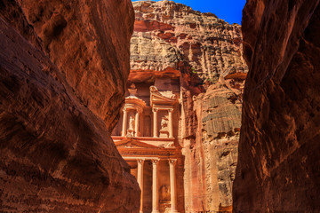 Sticker - A glimp of the Treasury seen from the siq at Petra the ancient City  Al Khazneh in Jordan