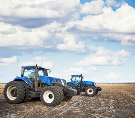 Poster - Two tractors work in the field