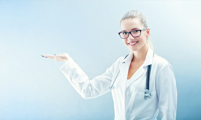 Young doctor woman smile face with stethoscope and white coat