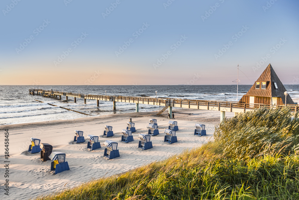beach chairs in morning light at the beach - obrazy, fototapety, plakaty 