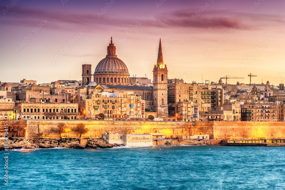Valletta, Malta: skyline from Marsans Harbour at sunset. The cathedral - obrazy, fototapety, plakaty 