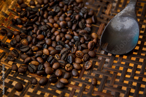 Fotografie, Obraz Winnowing a coffee beans by using traditional winnow.