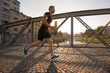 © .shock - man jogging across the bridge at sunny morning