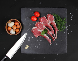 Wall Mural - Raw Beef with Bones on the Black Background