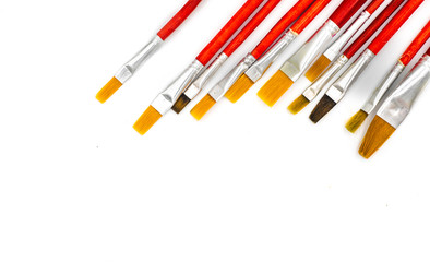 Assorted artists paint brushes isolated on a white background