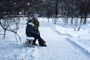 lovers on a bench in winter