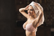 © LIGHTFIELD STUDIOS - beautiful sexy young woman in underwear and towel on head smiling and looking away at home