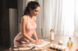 © LIGHTFIELD STUDIOS - sexy young woman in apron preparing dough at home