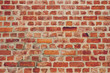 © waranyu - old wall brick background.  Mortar. Orange wall color background. Vintage wall