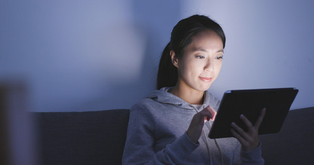 Canvas Print - Woman use of tablet computer at night