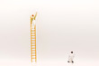 miniature people, mini figure with ladder and white paint in front of a wall and another one paint on bottom of wall.