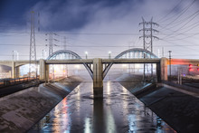 Sixth Street Viaduct Over Los Angeles River Against Cloudy Sky At Night