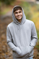 teenage boy walking alone on an atumn day