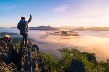 Man stand on top of the hill ,winner , success concept 