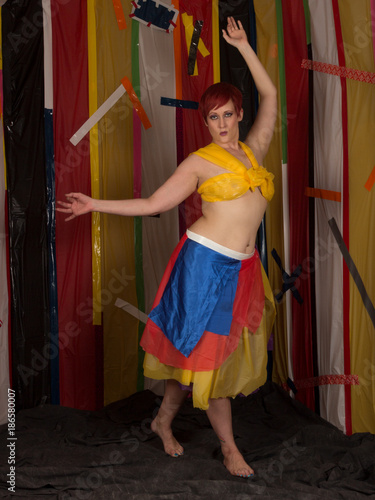 Pretty Pale Model With Short Red Hair In Experimental Trash Bag