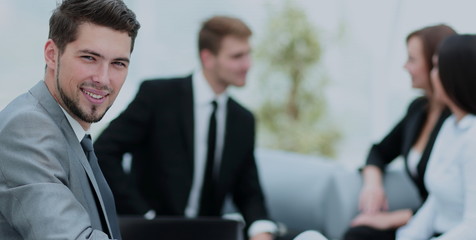 Poster - Portrait of business man  looking at camera on the background of