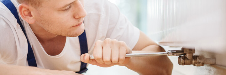 Plumber using screwdriver