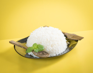 Sticker - Cooked rice on plate with a spoon and fork , thai jasmine rice