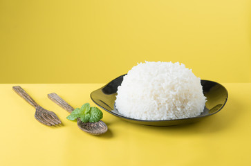 Sticker - Cooked rice on plate with a spoon and fork , thai jasmine rice