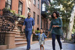 © Monkey Business - Family taking a walk down the street, close up