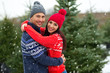 © pikselstock - Couple buying Christmas tree
