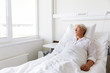 © Syda Productions - sad senior woman lying on bed at hospital ward