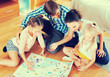 © JackF - Family playing at board game