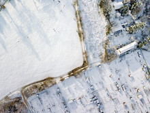 Aerial View Of Traditional English Allotments And Public Park Land Covered In Snow, Frost And Ice, Looking Down. Frozen Landscape After A Snow Blizzard Across The UK