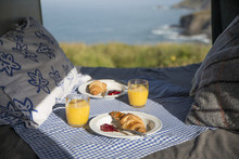 High Angle View Of Breakfast On Bed In Motor Home