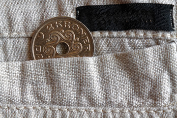 Denmark coin denomination is 2 krone (crown) in the pocket of old linen pants with black stripe